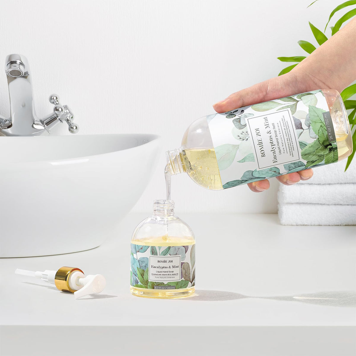 ROMIIE ZOI being poured into a dispenser to demonstrate refill convenience and reduced waste