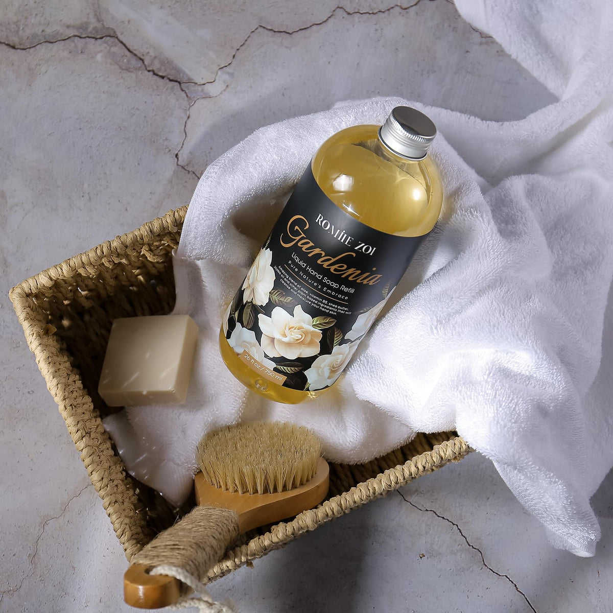 ROMIIE ZOI 750 ml bottle next to hand illustrating generous size