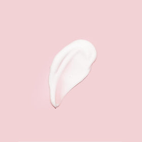 RoseSkinCo bottle on bathroom counter suggesting everyday routine benefit