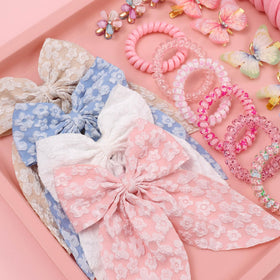 Rosvia embroidered toddlers hair bows close view showing clip attachment