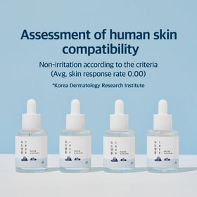ROUND LAB Dokdo ampule displayed on bathroom shelf in routine setting showing layering benefit