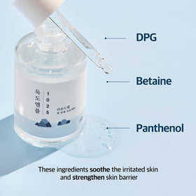 ROUND LAB Dokdo ampule held in hand demonstrating 45g size and travel-friendly benefit