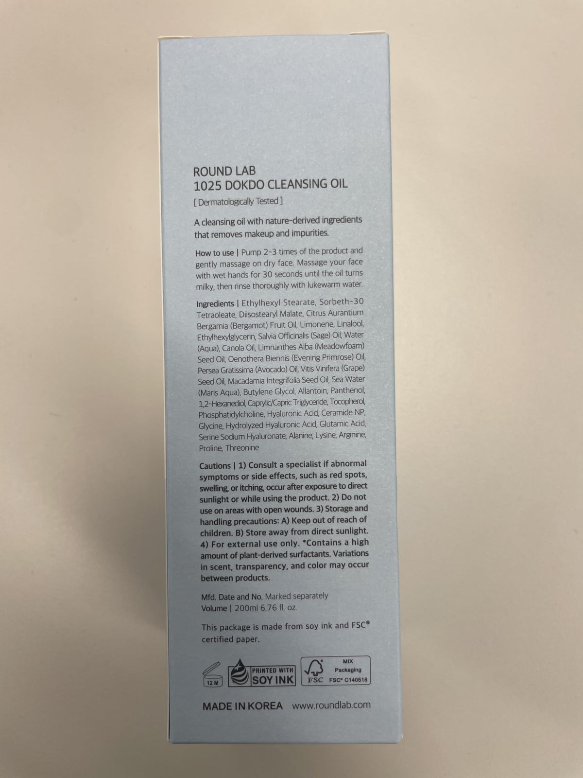 ROUND LAB cap and packaging detail showing secure closure and travel convenience