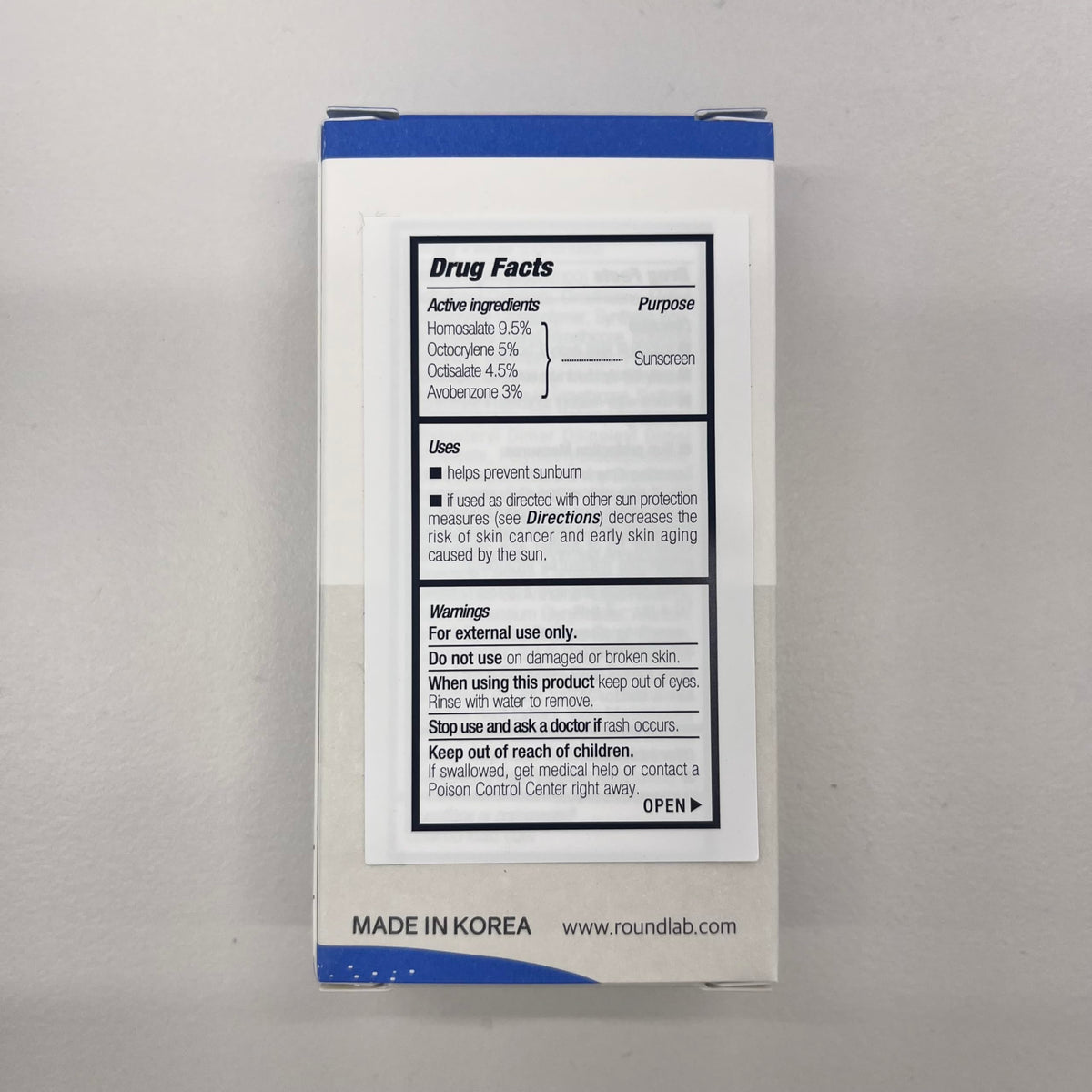 ROUND LAB sun stick in beach bag conveying outdoor, on-the-go protection