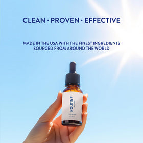 Routine Wellness product applied to scalp from hand demonstrating targeted nourishment for roots