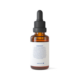 Routine Wellness bottle with rosemary argan tea tree ingredients flatlay showing natural formulation