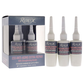 Roux 233 being applied to damp hair in hand, Roux restores strength and manageability