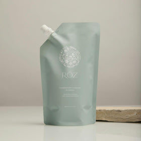 RŌZ pouch being poured into aluminum bottle demonstrating easy refill benefit