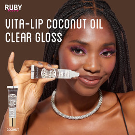 Ruby Kisses on model smiling to show glossy, natural-looking lips
