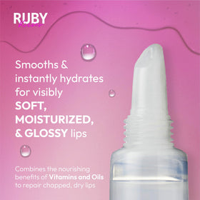 Ruby Kisses tube next to a coin showing compact travel-friendly size