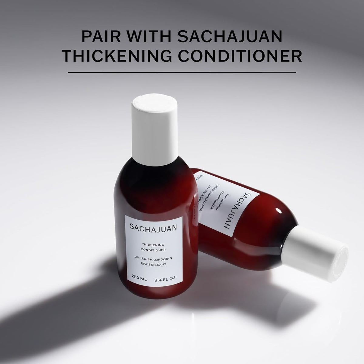 SACHAJUAN 8.4 oz bottle beside hand for size and travel-friendly benefit