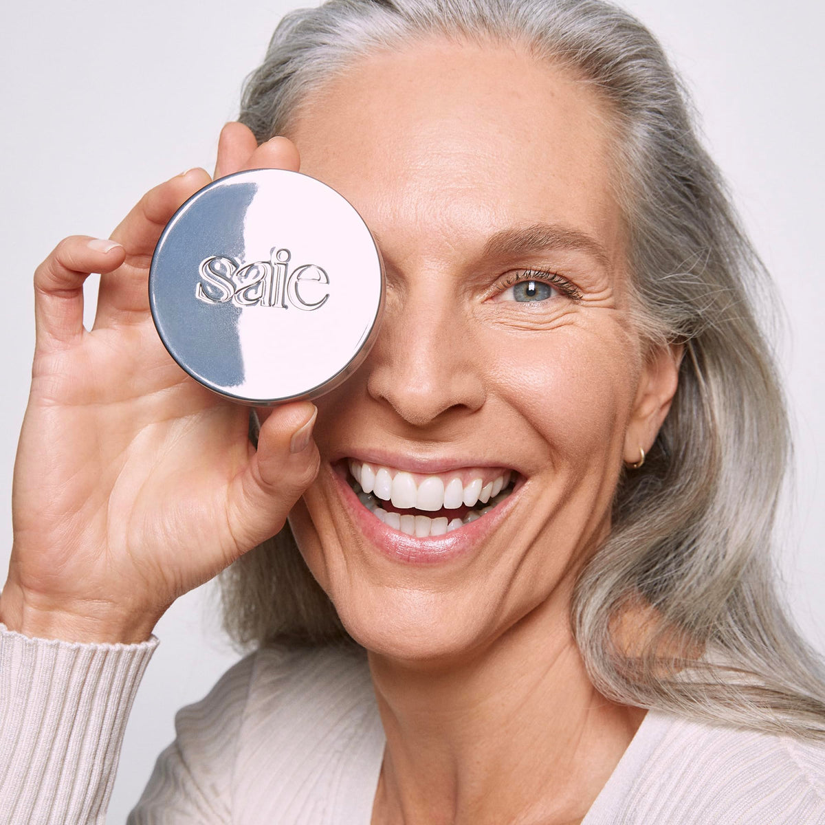 Saie before-and-after skin patch showing blurred pores and finish