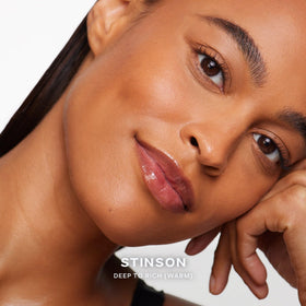 Saie Dew Bronze applied on cheekbones for natural sun-kissed glow