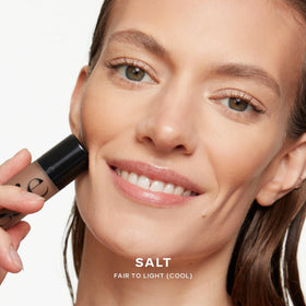 Saie Dew Bronze held in hand showing compact size and travel friendly benefit