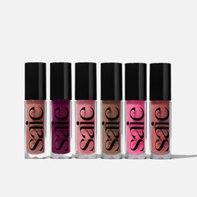 Saie Glossybounce layered over lipstick demonstrating added dimension and shine
