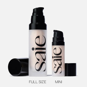 Saie Glowy Super Gel on a vanity beside skincare items showing everyday routine use