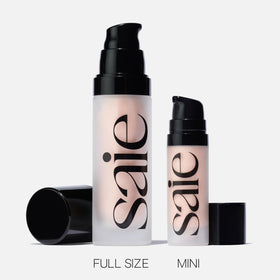 Saie mini Glowy Super Gel in a makeup bag for on-the-go glow