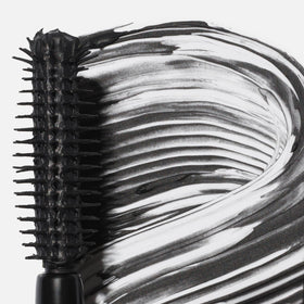 Saie mini mascara applied to upper lashes lifting and defining for impact
