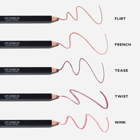 Saie lip pencil in hand scale comparison shows compact size for travel convenience
