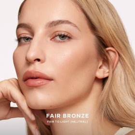 Saie buffing brush picking up cream bronzer for easy, even application