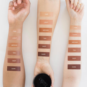 Saie lifestyle outdoor scene on woman showing sun-kissed glow benefit