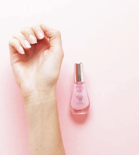 Sally Hansen applied on fingernail illustrating instant smoothing and protection
