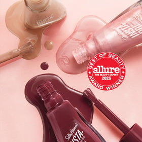Sally Hansen manicured nails in lifestyle scene showing long-lasting glossy wear
