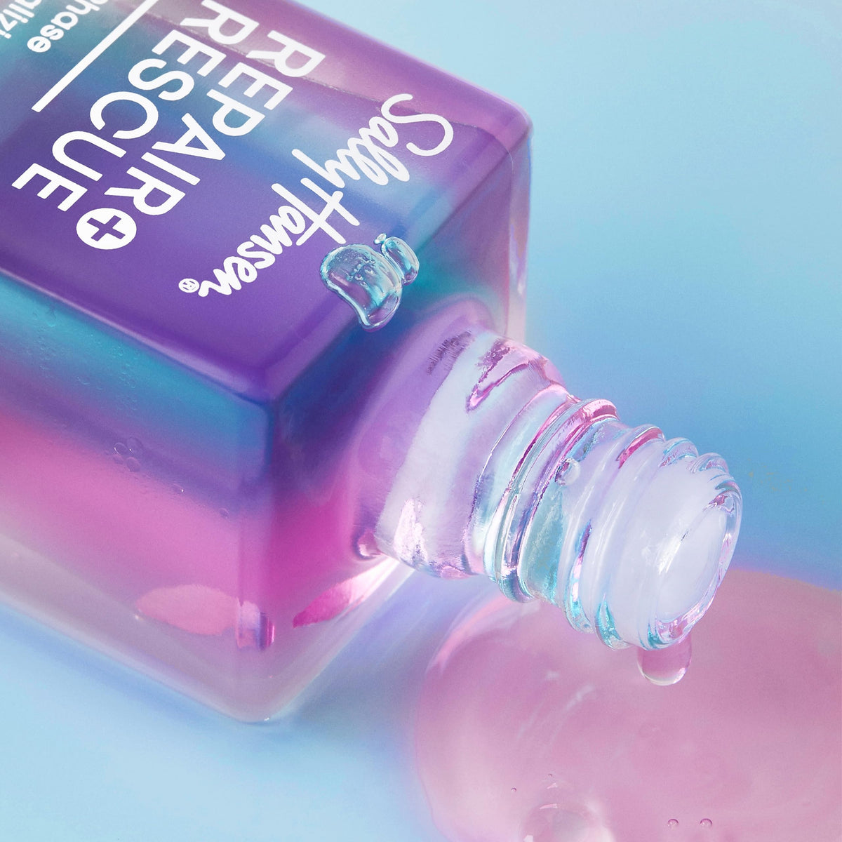 Sally Hansen held in hand for scale showing travel-friendly size and convenience