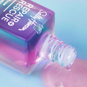 Sally Hansen held in hand for scale showing travel-friendly size and convenience