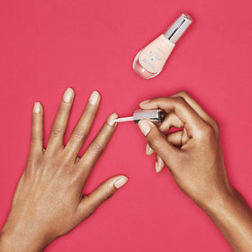 Sally Hansen ingredient bottles with jasmine and rose emphasizing botanical care