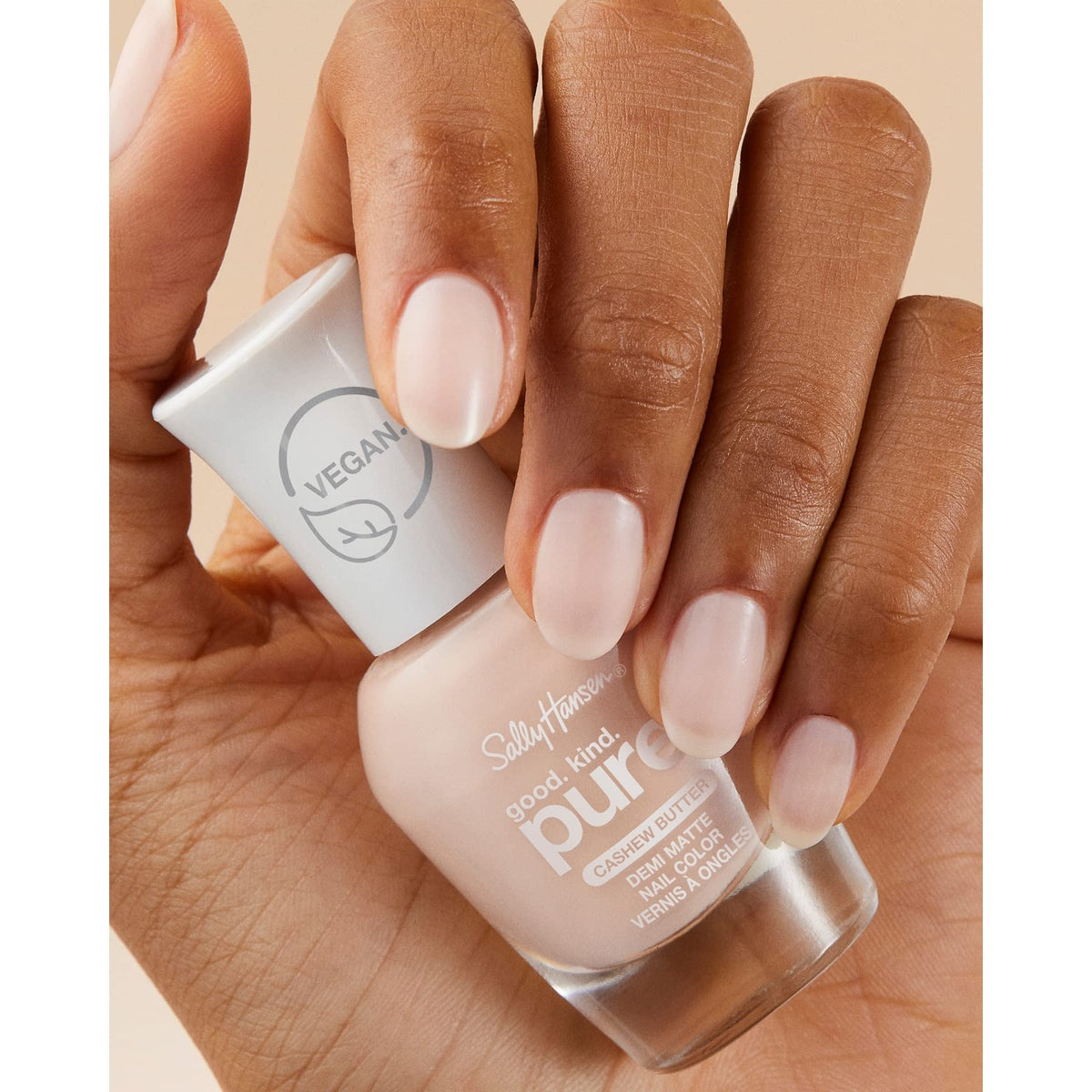 Sally Hansen bottle held in hand showing size and easy-use benefit