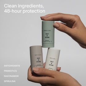 Salt & Stone applying deodorant underarm showing clear, residue-free finish