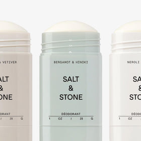 Salt & Stone bergamot & hinoki stick with citrus props showing bright scent benefit