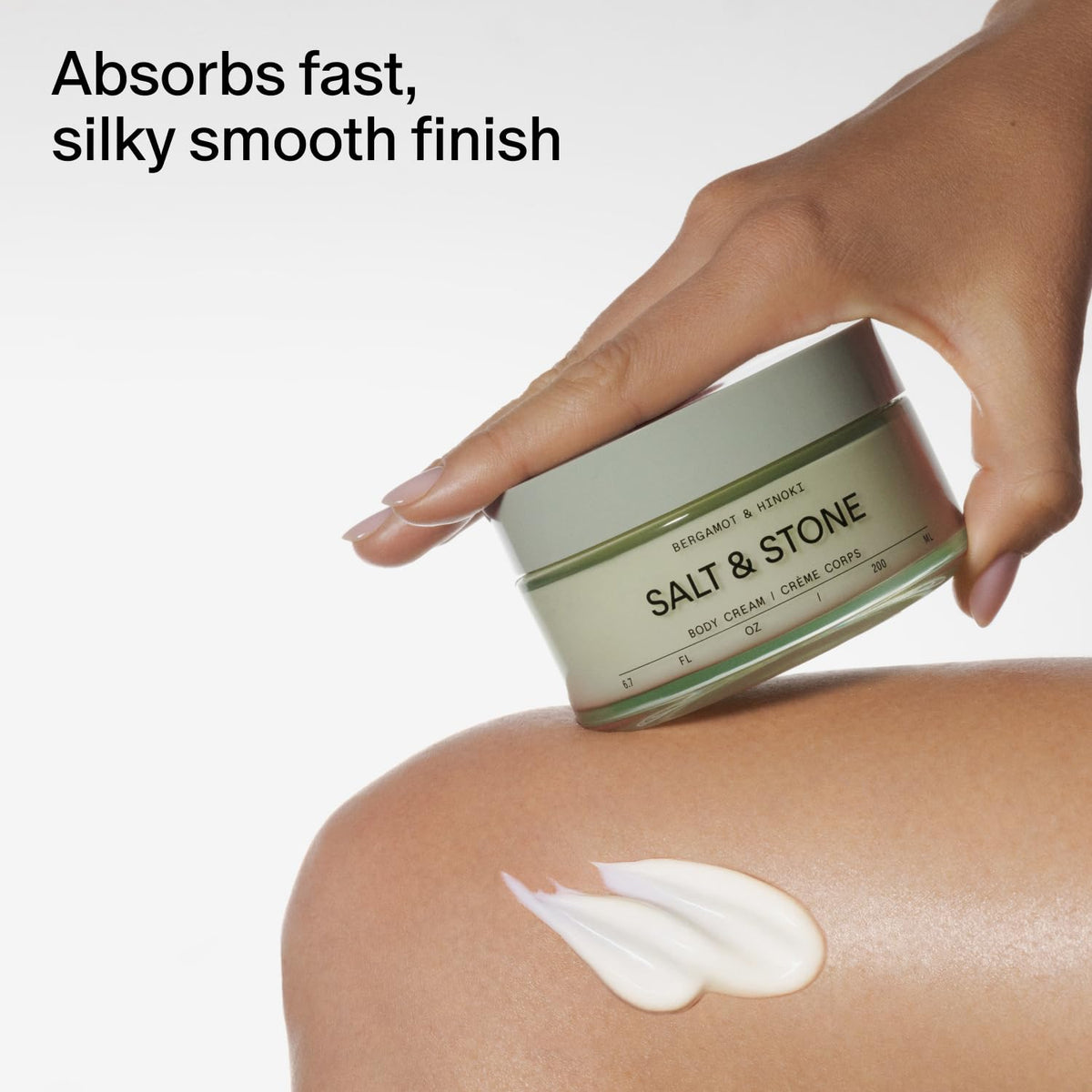 Salt & Stone close-up label with bergamot and hinoki notes, signals scent profile