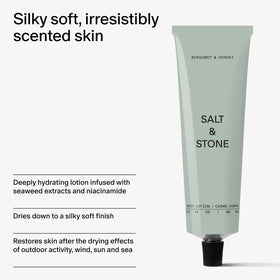 Salt & Stone tube beside a notebook showing 3.4 fl oz travel-ready portability