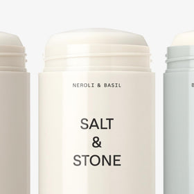 Salt & Stone deodorant stick held in hand for size comparison and travel-ready benefit