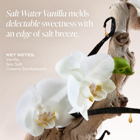 Saltair lifestyle image on a beach evoking salt water vanilla scent and fresh comfort