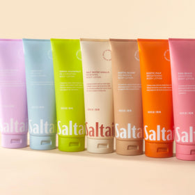 Saltair couple applying lotion showing shared daily hydration and smooth skin benefits