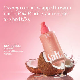 Saltair bottle staged on sand evoking tropical Pink Beach scent