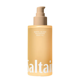 Saltair pump bottle front view showing elegant Santal Bloom packaging and quick application benefit