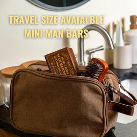 San Francisco Soap Company man bar beside travel case showing portability and mess-free packing benefit