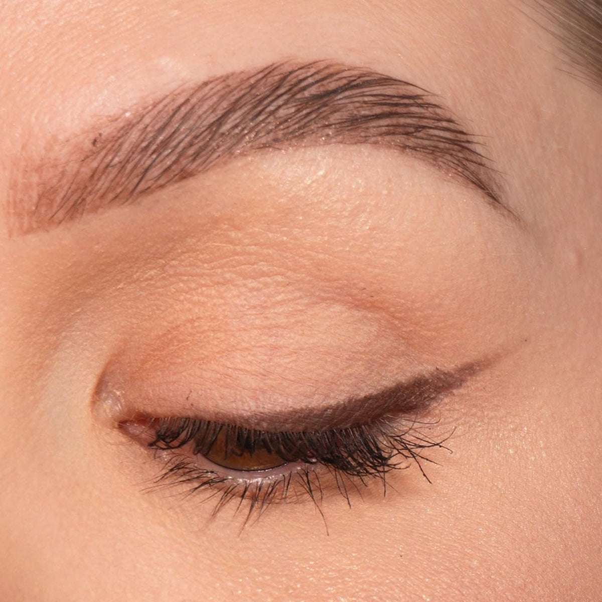 Sandstone Scandinavia brown stroke on skin illustrating rich pigment and blendable finish