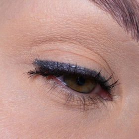 Sandstone Scandinavia grey eyeliner creamy texture close-up illustrating smooth glide and metallic sheen