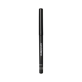 Sandstone Scandinavia pencil next to coin showing compact size and portability