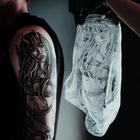 Saniderm in tattoo studio lifestyle setting showing professional use and artist trust benefit