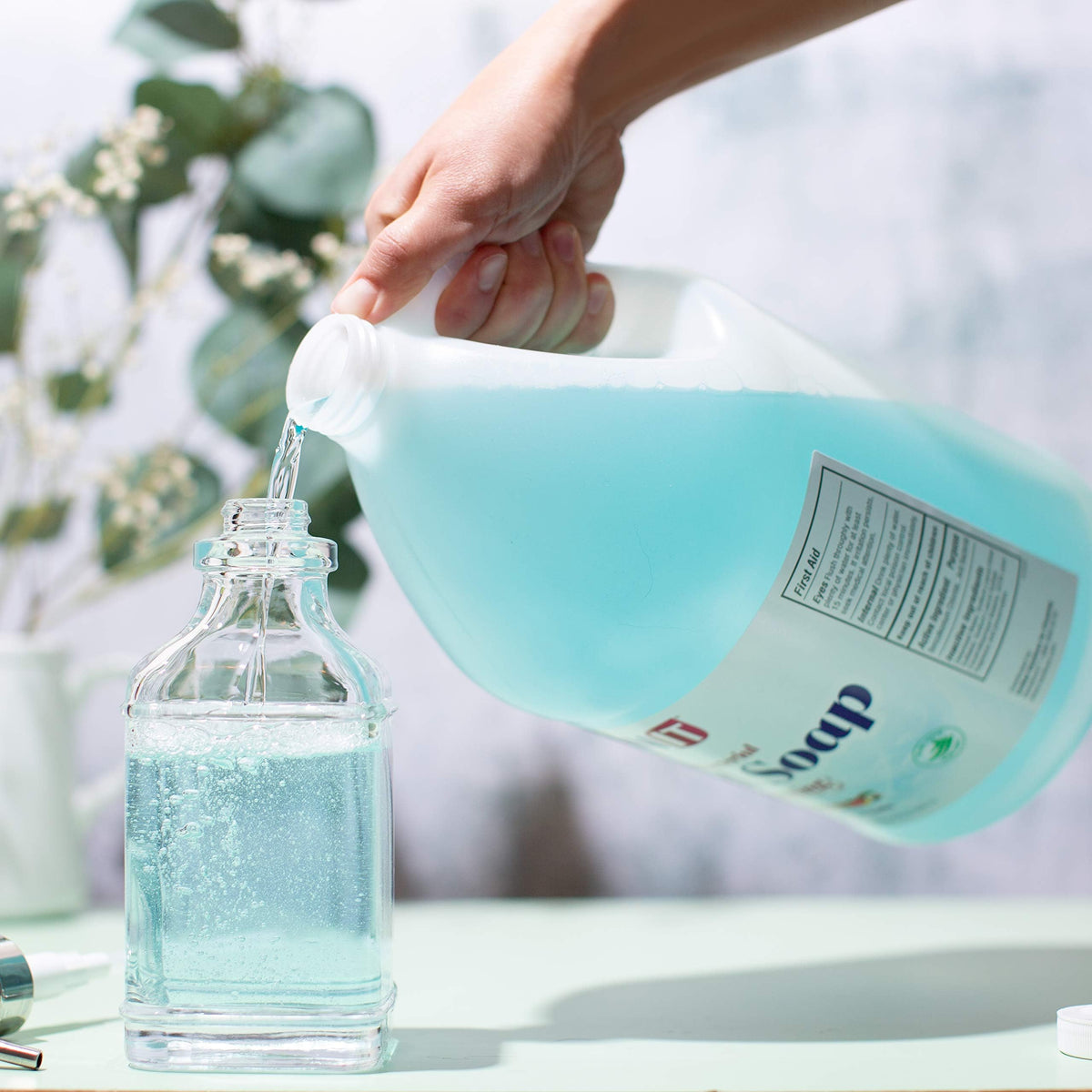 Sanit refill pour neck close-up illustrating easy transfer into foaming dispenser