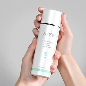 Sanitas cleanser in hand being dispensed, illustrating easy application and nourishment
