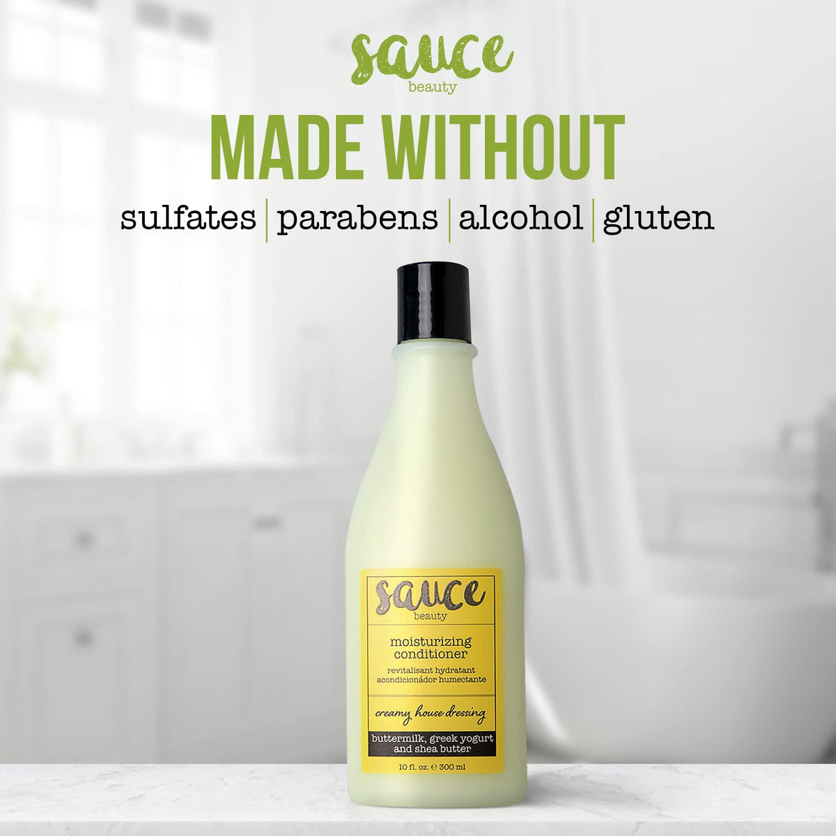 SAUCE BEAUTY 10 fl oz bottle beside hand to show true size and travel-friendly benefit