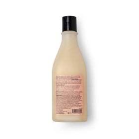 SAUCE BEAUTY 10 fl oz bottle held in hand showing true size and portability