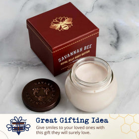 Savannah Bee Company jar beside everyday items to show compact travel-friendly size